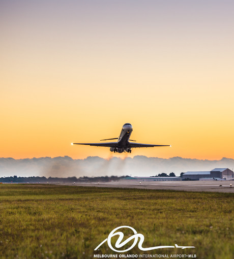 a delta jet takes off at sunrise